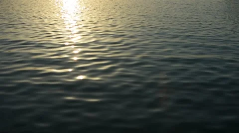 Sunset Light Reflected in the Ripples of a Calm Sea Video stock 67830800