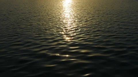 Sunset Light Reflected in the Ripples of a Calm Sea Video stock 67830831