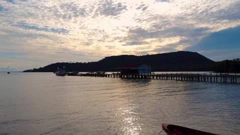 Sunset light so calm and bright as boats rest in fading night Stock Footage 320925324