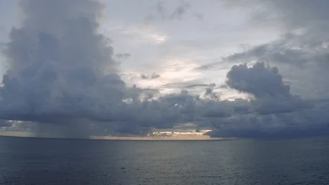 Sunset light TIMELAPSE in Clouds and Ocean next to Bali Island 4K Drone shot Stock Footage 119335431