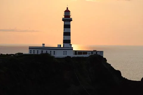 Sunset at the lighthouse of Ponta da Barca, Graciosa island, Azores Stock Photos