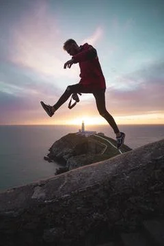 Sunset at the lighthouse of wales Stock Photos