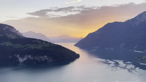 Sunset lights behind the mountains and lake Stock Footage 255302741