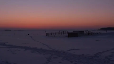 Sunset at a lonely riverside. Winter time. Land covered with snow 스톡 동영상 72728554