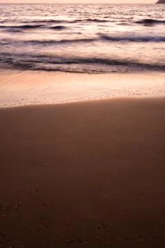 Sunset long exposure waves sand greece europe Stock Photos