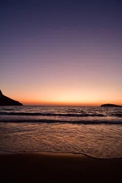 Sunset long exposure waves sand greece europe Foto stock
