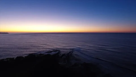Sunset looking out over soft ocean Video stock 132310371