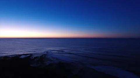 Sunset looking out over soft ocean Video stock 132310374
