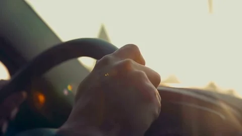 Sunset looking out the window inside a car, driving dashboard and steering Stock-Footage 336268022