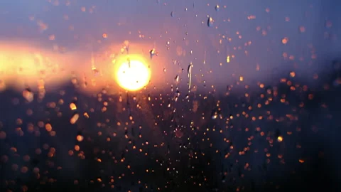 Sunset, looking through the glass window, raindrops, bright sunset Stock-Footage 283935863