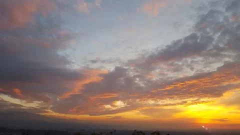 A sunset with a lot of clouds in the sky Stock Photos