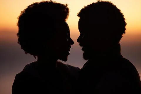 Sunset, love and silhouette of black couple in nature for romance, bonding and Stock Photos