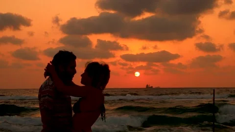Sunset lovers kissing Stock Footage 155541505