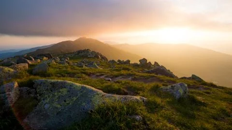 Sunset At Low Tatras, Setting Sun Shines Through Clouds Over The Mountain Stock Photos