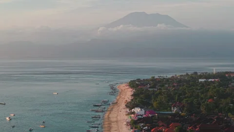 Sunset at low tide at Jungutbatu beach Nusa Lembongan, Bali Indonesia. Volcano Stock Footage 316647222