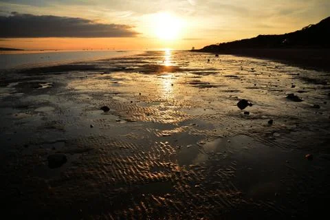 Sunset at low tide Stock-Fotos
