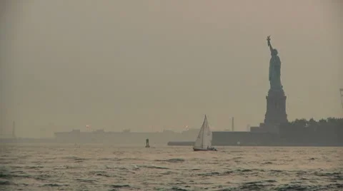 Sunset - Lower Manhattan - Statue of Liberty and Boats Stock Footage 8916704