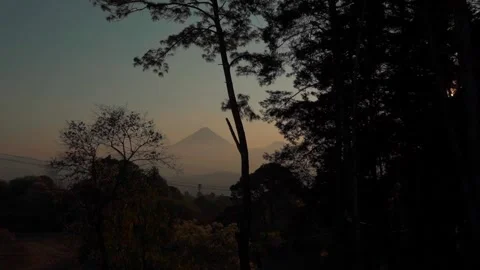 Sunset with a Majestic Volcano in the Background Stock Footage 293413741
