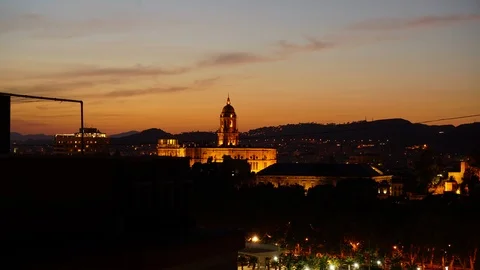 Sunset in Malaga spain on the bell tower and city lights Stock Footage 96213769