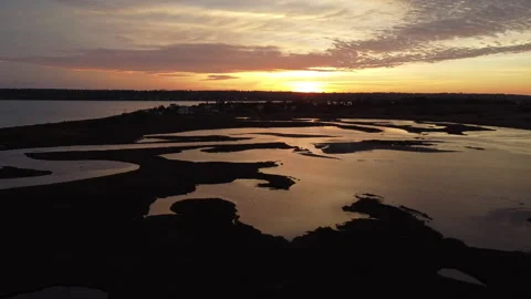 Sunset Marsh Reflections in a Beautiful Aerial Shot Stock Footage 275301446