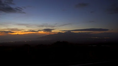 Sunset on Maui shot from Rice Park in Kula Upcountry with Cars Passing on Bottom Video stock 119136102