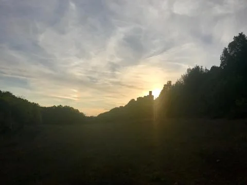 Sunset with medieval castle in Tuscany Stock Photos