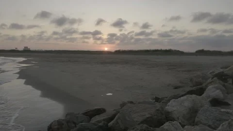 Sunset on a Mediterranean beach Stock Footage 138745141