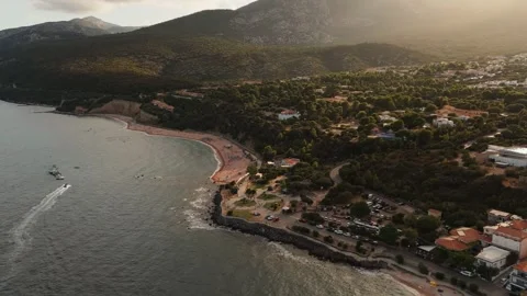 Sunset Mediterranean Beach Resort and Seaside Greenery, Aerial Video stock 340327786