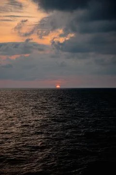 Sunset in the middle of the ocean Stock Photos