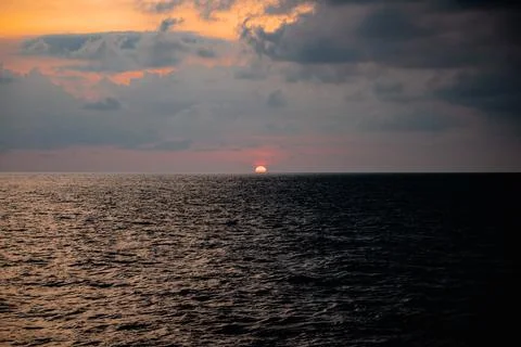 Sunset in the middle of the ocean Stock Photos