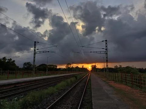 Sunset middle in railroad tracks. railway at sunset. Stock Photos