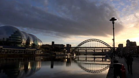 Sunset millennium bridge Newcastle upon Tyne bridges across the Tyne river UK 4K Stock Footage 105351947