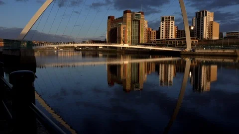 Sunset millennium bridge Newcastle upon Tyne bridges across the Tyne river UK 4K Stock Footage 105352575