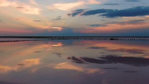 Sunset like a mirror is reflected in the lake. It is Ukraine. Stock Footage 137919734