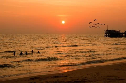 Sunset in mist on the beach Stock Photos