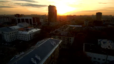 Sunset in a modern city.The sun is reflected in the skyscraper. Stock Footage 132580014