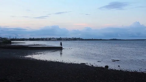 Sunset moment at the beach with blue and pink sky Stock Footage 124304060