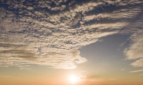 Sunset in moody sky. Sunset rays on cumulus. Sunset bright dusk background. S Stock Photos