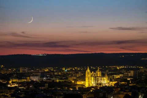 Sunset with moon panoramic view of the city of Leon Spain gothic cathedral Stock Photos