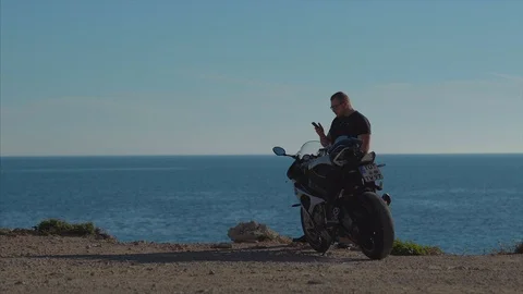 Sunset motorcycle man. Stock Footage