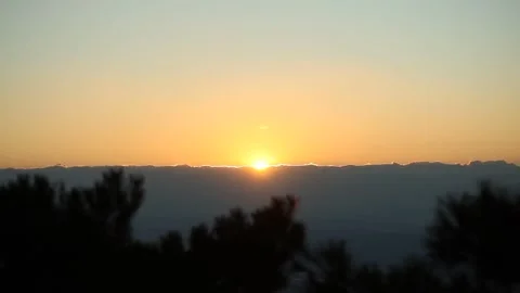 A sunset on the mountain and trees Stock-Footage 303392547
