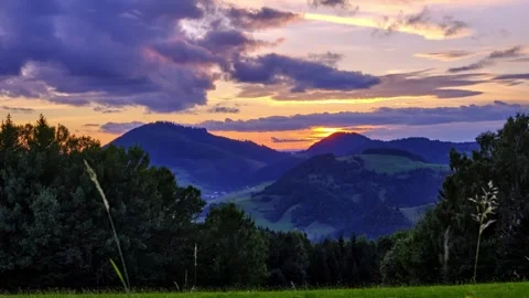 Sunset in the mountain forest landscape in summer, pastel color of the clouds Stock Footage 250801980