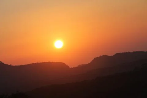 Sunset with mountain Stock Photos