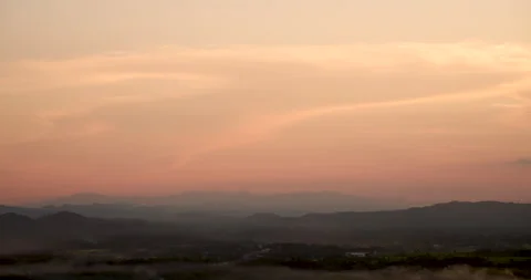 Sunset mountain range beautiful landscape mist, dusk golden time dramatic sky. B Stock Footage 147165158
