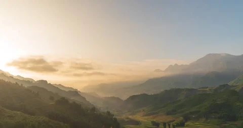 Sunset mountain range beautiful landscape mist, dusk golden time dramatic sky. B Stock Footage 154618489