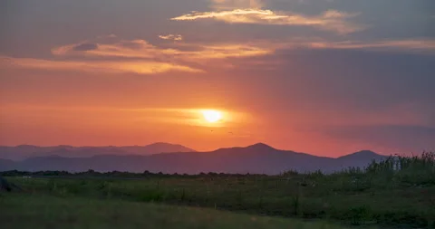 Sunset mountain range beautiful landscape mist, dusk golden time dramatic sky. B Stockbeeldmateriaal 155085268