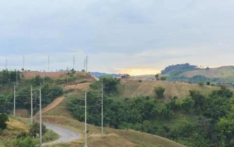 Sunset with mountain road. Stock Photos
