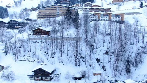 Sunset Mountain Ski Resorts Accommodations on hill   Austria Europe Aerial view Stock Footage 104232349