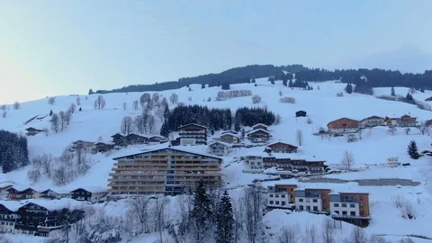 Sunset Mountain Ski Resorts Accommodations on hill   Austria Europe Aerial view Stock Footage 104232358