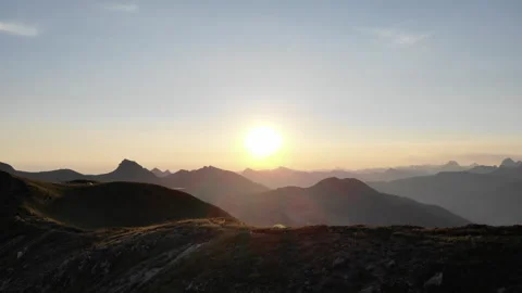 Sunset on the mountain. Tent erected on top Stock Footage 266282259